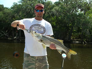 a happy fisherman with daytona's captian barry