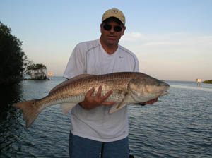 a happy fisherman with daytona's captian barry