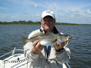 a happy fisherman with daytona's captian barry