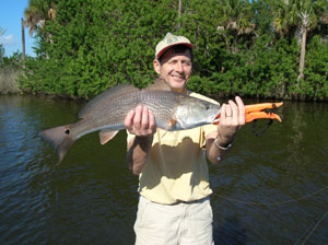 a happy fisherman with daytona's captian barry