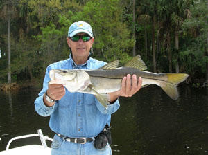 a happy fisherman with daytona's captian barry