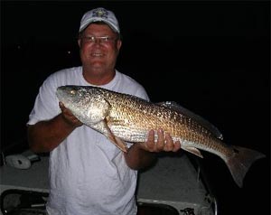 a happy fisherman with daytona's captian barry