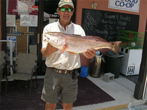 a happy fisherman with daytona's captian barry